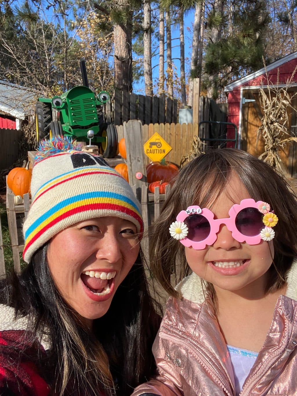 Momo Hayakawa smiling with her daughter at a pumpkin patch